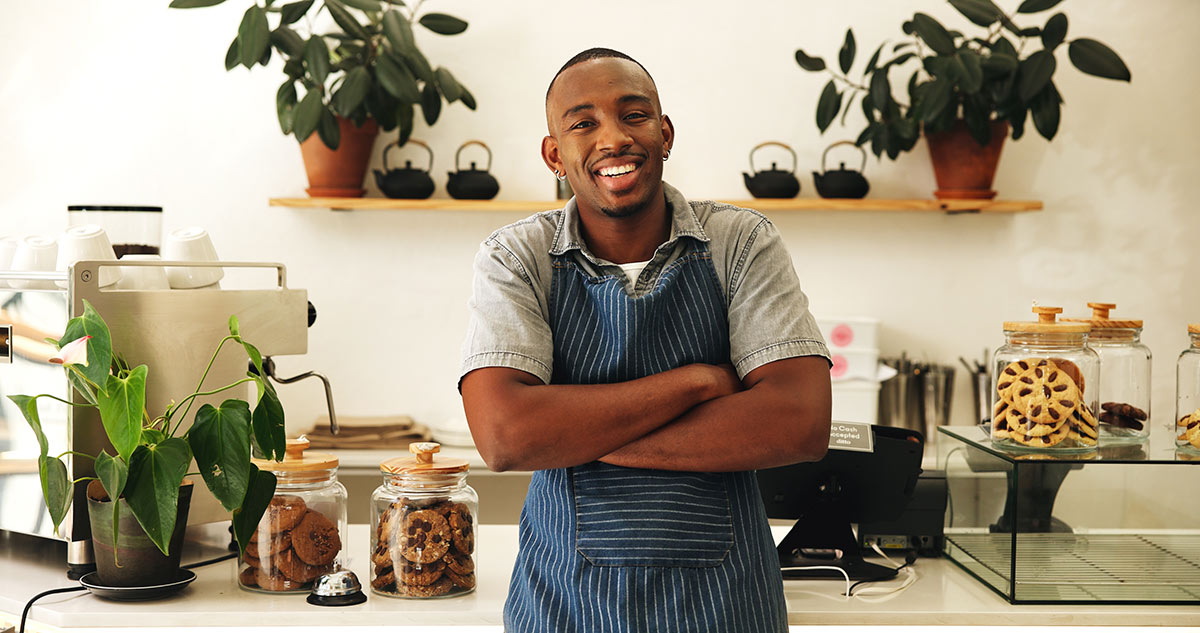 confident-black-man-and-waiter-with-portrait-