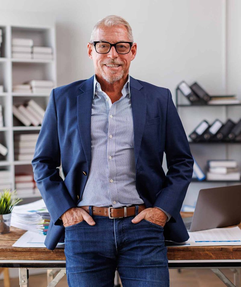 man-in-blue-blazer-stands-in-office-2026-03-19-07-06-271-utc